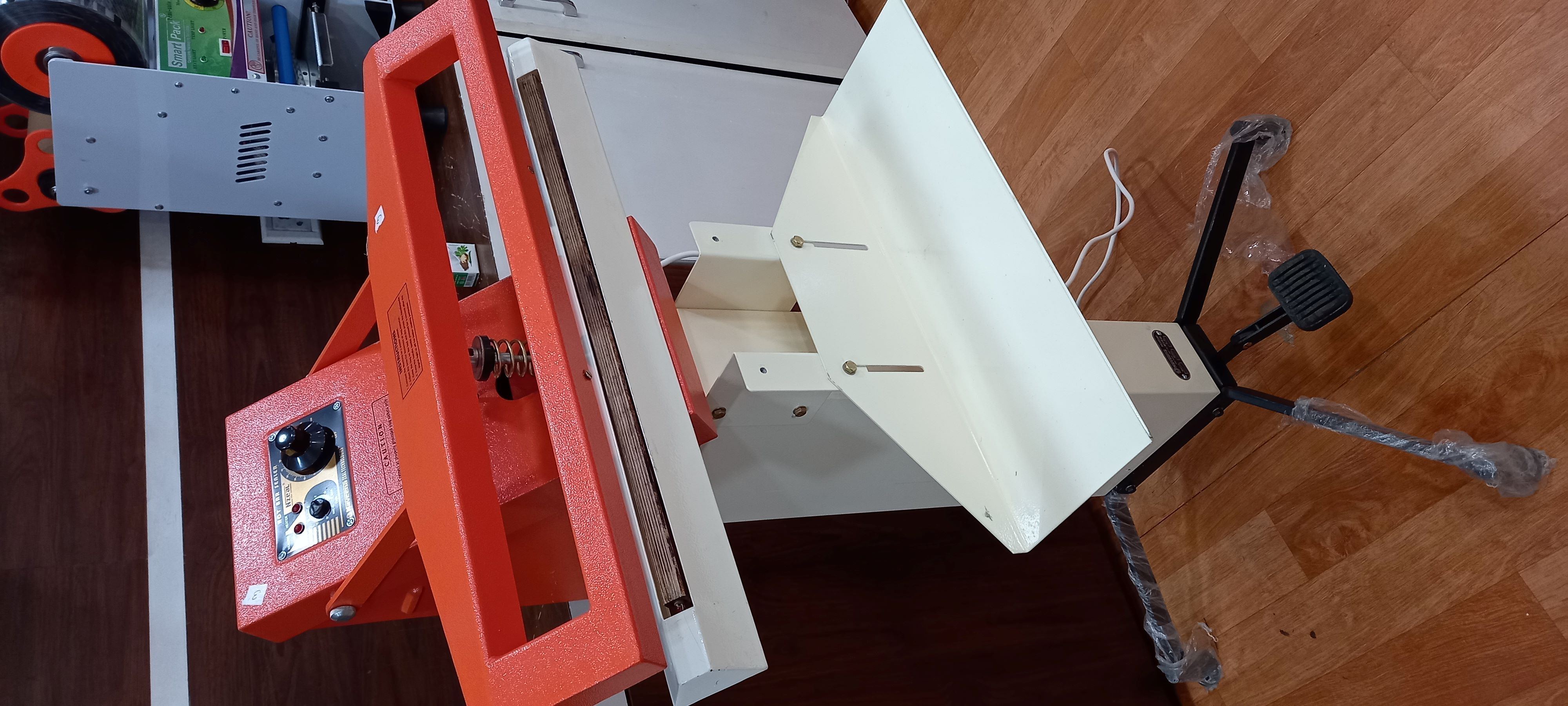 Orange Pedal Sealer Machine